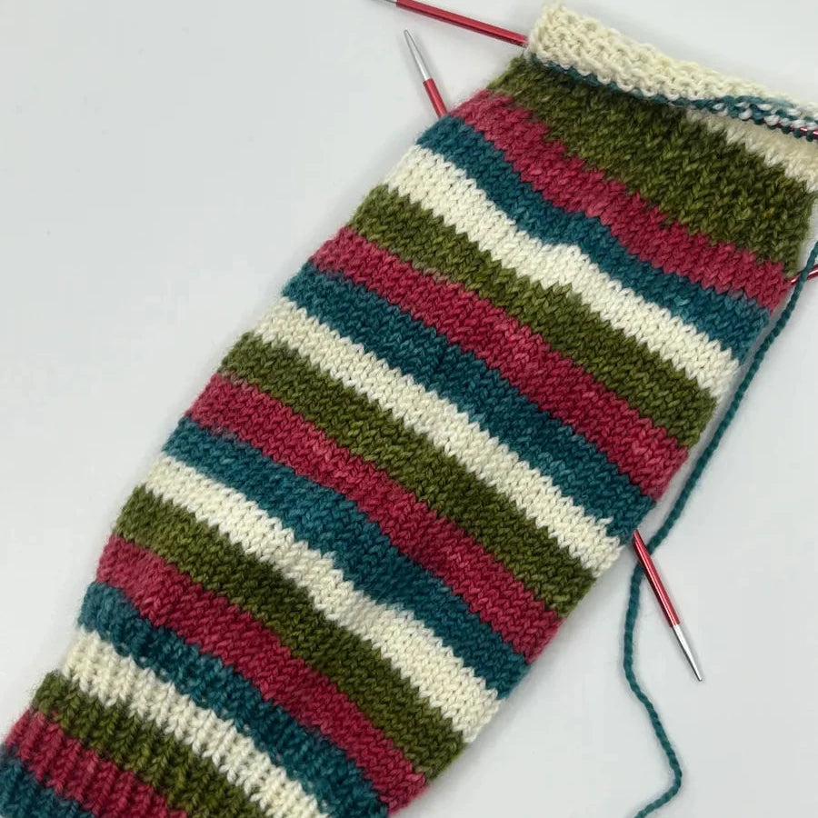 a sock with a knitting needle