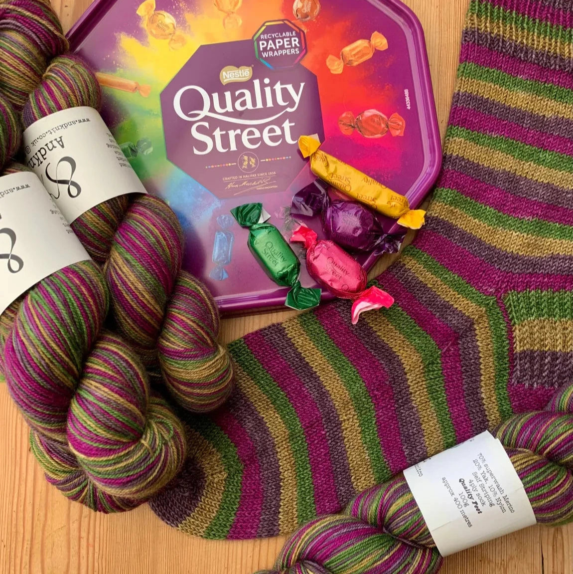 a colorful sock with a box of candy on it